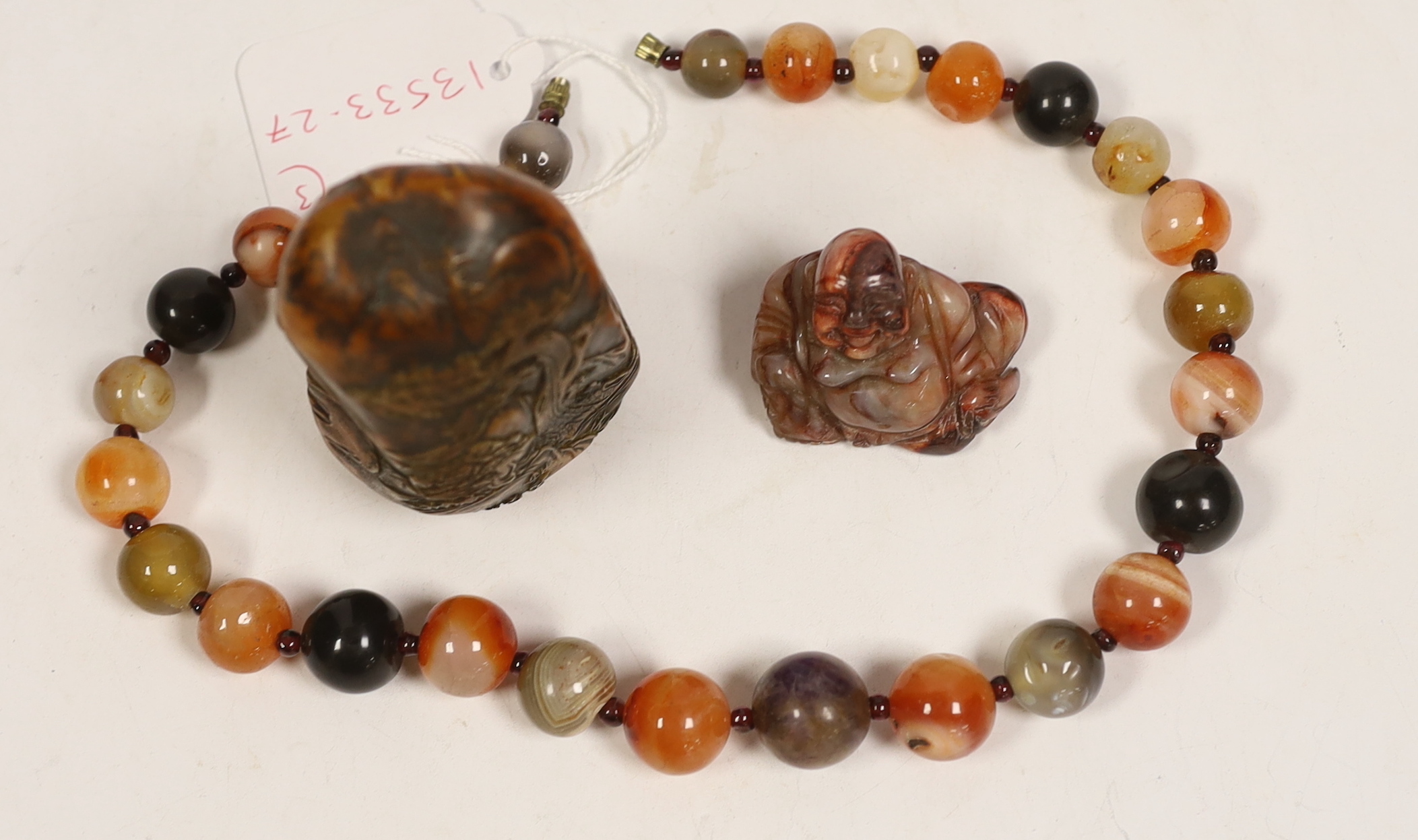 An agate bead necklace, a Chinese soapstone seal and a miniature carved agate Buddha, 4cm